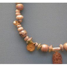 Glass necklace with gold pendants, solar disc